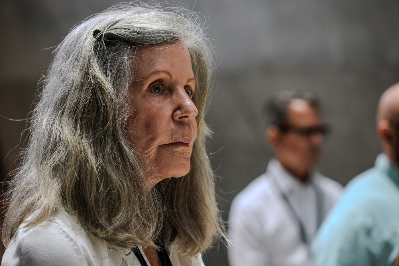 A woman listens closely during a session.